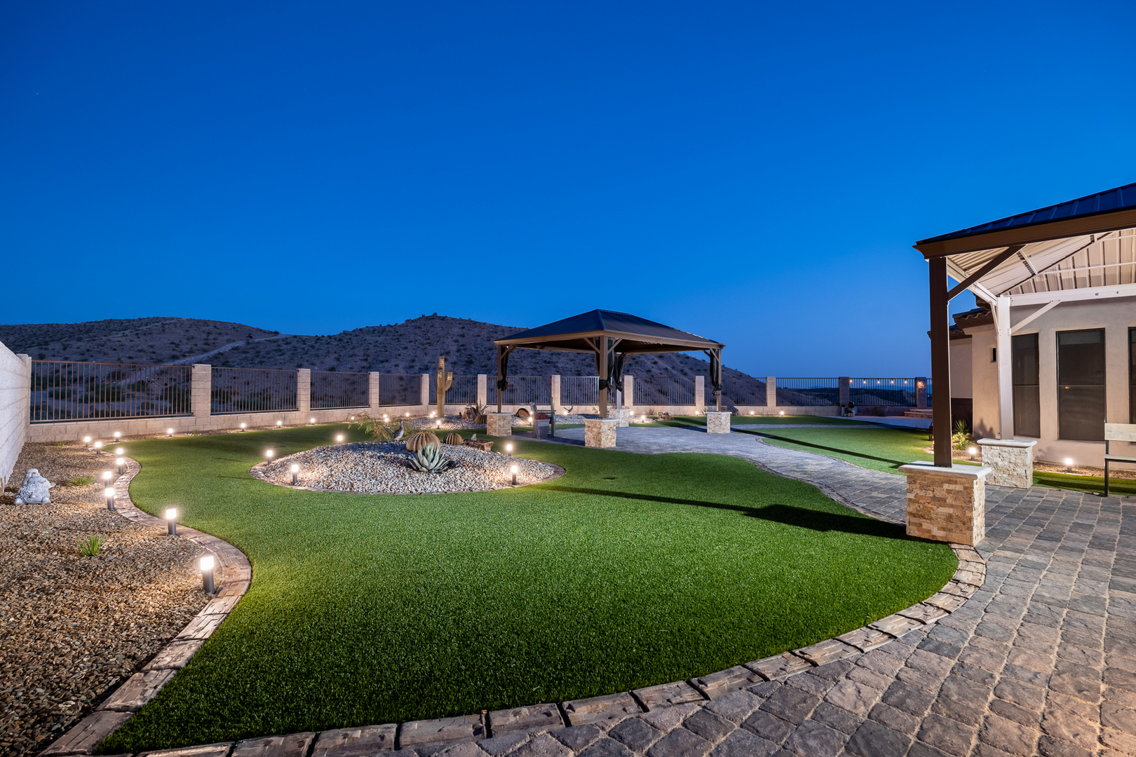 Backyard turf with gazebo and landscape lighting in Bullhead City